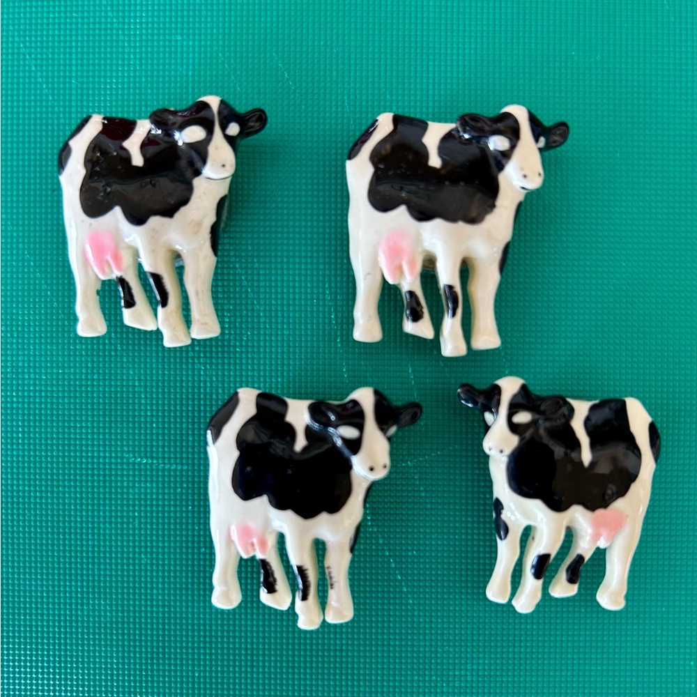 Three Cow Button Covers . They slide on and then snap on. Adorable